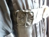 a belt with a bow on it that is attached to a dress