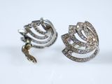 pair of diamond earrings on a white background