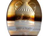 a picture of a glass object with a vase on it