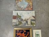 many paintings on the floor of this room