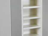 a tall white bookcase with many shelves in it