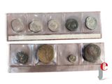 several different types of coins are in a display case
