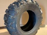 a tire that is sitting on the floor next to a wall