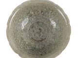 bowl on a white surface with a circular design on the surface