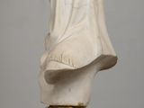 marble bust of a woman with a veil on her head