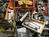 a pile of assorted items in a bin on the floor
