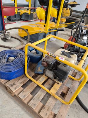 a yellow fire hydrant sitting on top of a pallet