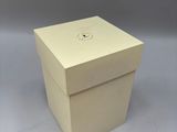 a white box that has a clock on it