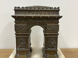an image of a bronze sculpture of a triumph gate on a marble base