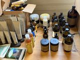 many bottles and containers on a wooden table