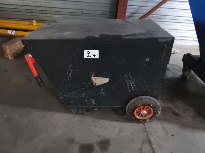 a black box with a number on it sitting in a garage