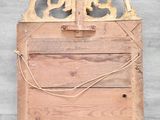 an old wooden sign hanging on the side of a wall