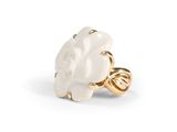 a gold ring with a white flower on it