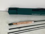 a close up of a pair of fishing rods on a table