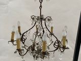 a chandelier that is hanging from the ceiling