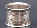 a close up of a silver ring on a table