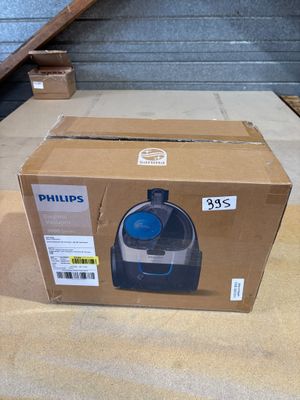 une boîte contenant une machine bleue et blanche
