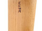 a close up of a bamboo toothbrush holder with a toothbrush