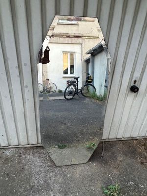 a bike that is sitting in the doorway of a building