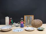 a wooden table topped with bowls and pictures on it