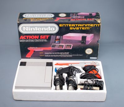 nintendo entertainment system in a box with power cords and accessories