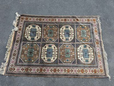 rug on the ground with a lot of different designs on it