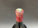 a bottle of wine that is sitting on a table