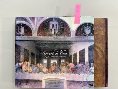 a picture of a book with a picture of the last supper on it