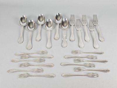 many forks and spoons laid out on the table