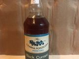 a bottle of black curran syrup sitting on a table