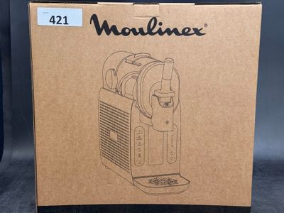 the box for the machine is open and ready to be used