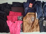 a pile of clothing on a table with a price tag