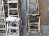 several ladders and a table in a room