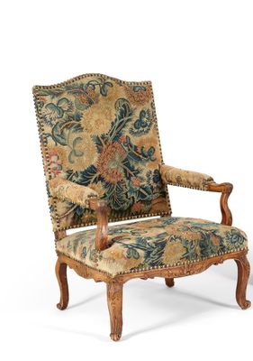 une image d'une chaise avec un dossier rembourré à motifs floraux