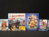 a lot of movies on display on a black table
