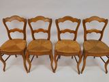 four chairs are lined up against a white background
