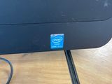 an image of a computer monitor sitting on top of a wooden table