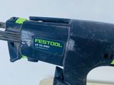 a close up of a small electric drill on a table