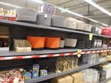 many different types of dishes on the shelves in the store