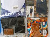 the contents of a flight attendant costume laid out on a table