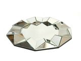 a mirror that has been placed on a white surface