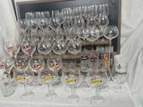 a lot of wine glasses on the table