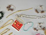 many different types of jewelry on the table