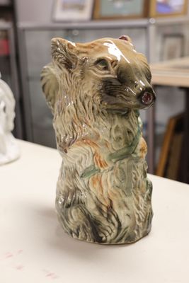 a ceramic bear that is sitting on a table