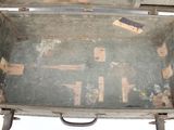 an old suitcase that has been left open on the floor