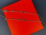 a red square box with a chain and a silver clasp on it