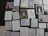 a lot of drawings on the floor of this room