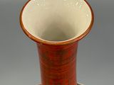 an image of a vase on a table with a gray background