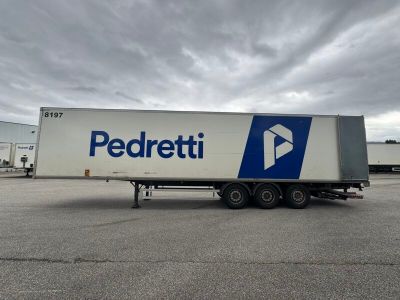 a picture of a semi trailer parked in a parking lot