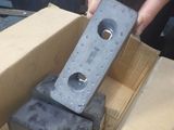 a person that is holding a piece of metal in a box